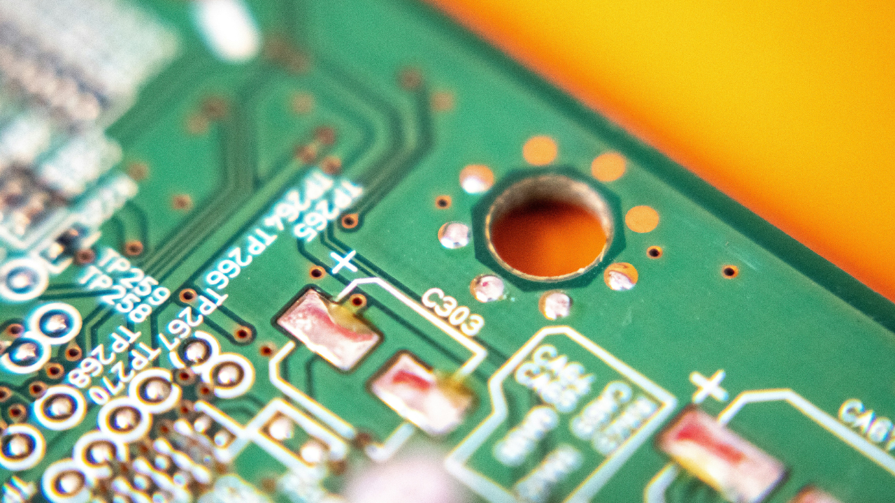 Close-up of a green circuit board used in electronic devices such as pagers