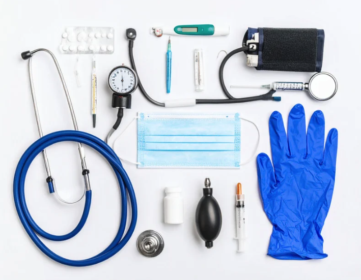Images of items used when practicing healthcare: gloves, syringes, stethoscope, etc.